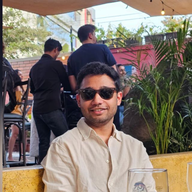 Satyam Bora, a software engineer, photographed from the shoulders up against a plain background.